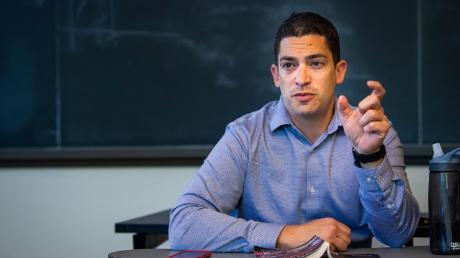 Brian Mello, professor of political science and director for the Center for Ethics, teaches a class on campus.
